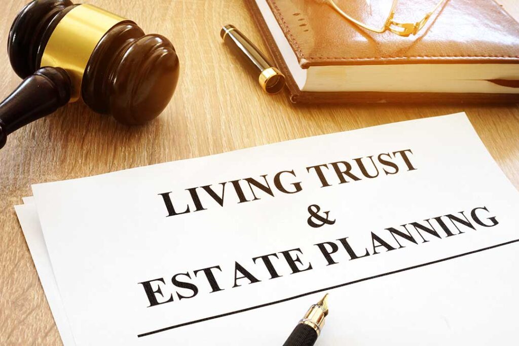 A person reviews a revocable trust document with a successor trustee at a home office desk.